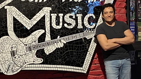 Entertainment 360 Gabriel Luna standing next to a South Austin Music sign (Credit: Entertainment 360)