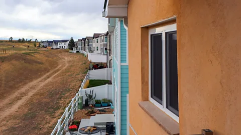 Nick Aspinwall A row of houses and a dirt track (Credit: Nick Aspinwall)