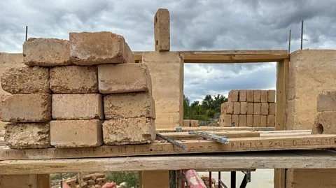 Nick Aspinwall Melanie MacKinnon and her husband are rebuilding their home in Longmont, Colorado using earth bricks (Credit: Nick Aspinwall)