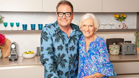 Mary Berry and Alan Carr smiling at the camera