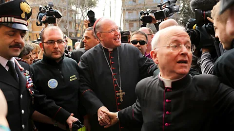 Getty Images' Cardinals make their way through the media hustle and bustle ahead of the 2013 conclave (Source: Getty Images)