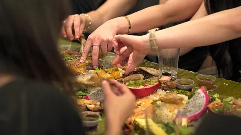 Darryl Laiu/ BBC Kamayan feasts are one of the ways Filipino communities around the world come together to celebrate big events (Credit: Darryl Laiu/ BBC)