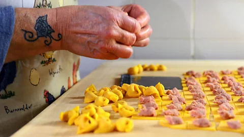 Getty Images Monica Venturi and her family have been making tortellini by hand at their shop in Bologna for nearly 30 years (Credit: Getty Images)