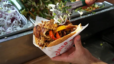 Getty Images In the classic Berlin döner, pita bread is stuffed with spiced meat, salad and sauce (Credit: Getty Images)