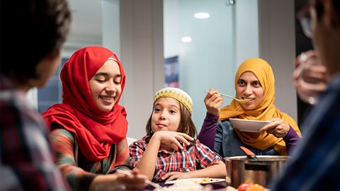 A muslim family eating Iftar and enjoying breaking of fasting