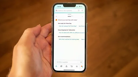 Getty Images A hand holding a phone with Amazon's AI shopping assistant Rufus on the screen (Credit: Getty Images)