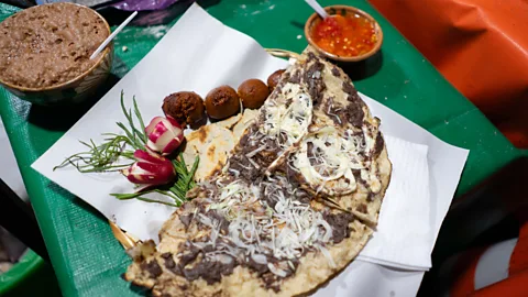 Alberto Lopez Tlayudas are an one of Oaxaca's iconic street foods, and for Chef Ruiz, the best in town are made by Doña Tere (Credit: Alberto Lopez)