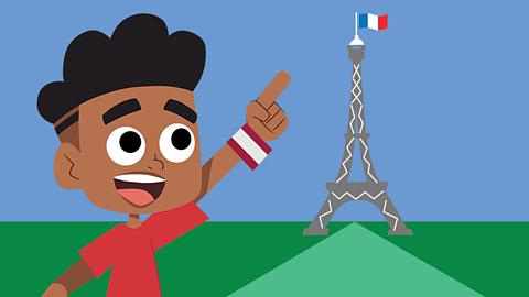 A young child pointing excitedly at the Eiffel tower