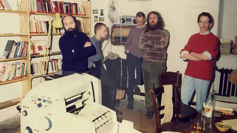 The Stasi Records Archive Five environmental activists in a basement in East Berlin stand by a printer (Credit: The Stasi Records Archive)