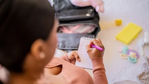 Getty Images Writing tasks on a piece of paper is an exercise known as "cognitive unloading" (Credit: Getty Images)