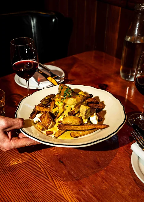 Scott Usheroff Martin Picard's legendary Montreal restaurant serves an ultra-decadent poutine topped with foie gras (Credit: Scott Usheroff)