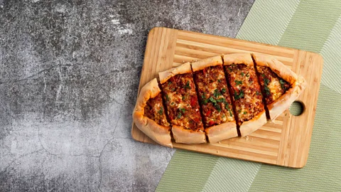 Alamy Pide, a canoe-shaped flatbread stuffed with savoury ingredients, is pillowy soft and perfect for sharing (Credit: Alamy)