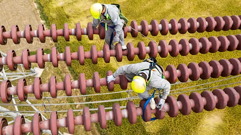 Getty Images After construction, UHV lines require careful maintenance (Credit: Getty Images)