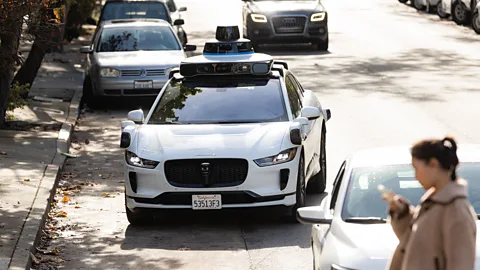 Getty Images A Waymo robotaxi pulls over on a street in San Francisco (Credit: Getty Images)