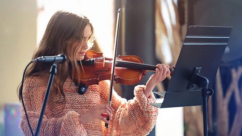 Teenage girl playing the violin