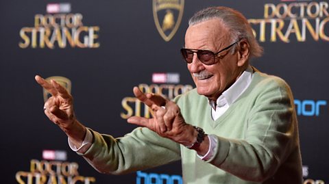 Comic book writer Stan Lee standing at the Doctor Strange premiere