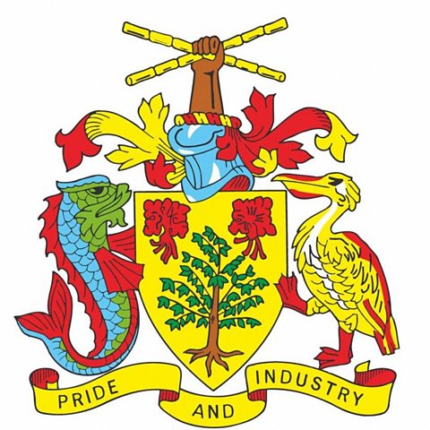 The Barbados Coat of Arms, featuring a hand holding two sticks of sugar cane in the shape of a cross, flanked by a fish and a bird