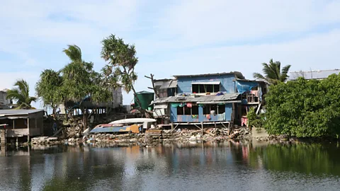 Alamy Much of Tuvalu's land, including many homes and its critical infrastructure, will sit below the level of the current high tide by 2050 (Credit: Alamy)