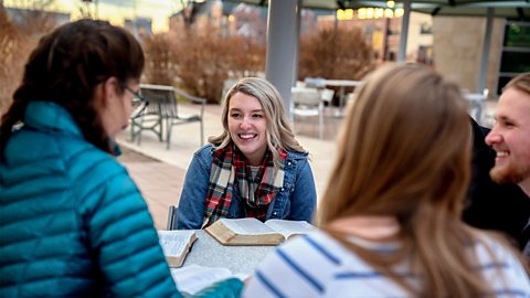 A group of students sat reading the Bible together