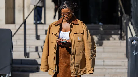 Getty Images Carhartt's barn jacket started out as workwear – now it's also worn by the fashion-conscious (Credit: Getty Images)