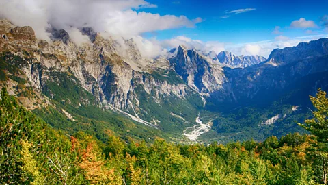 Alamy Mountains and a forested valley in the Balkans (Credit: Alamy)