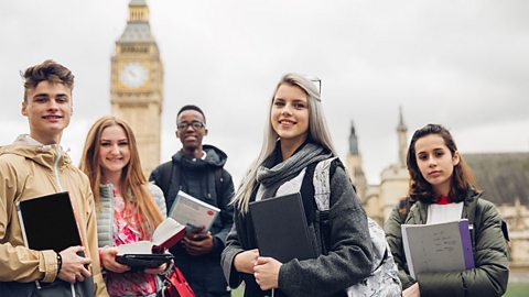 A group of teenagers stood outside Westminster in London