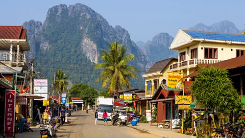 Getty Images A neighbourhood in Vang Vieng, Laos lined with guesthouses (Credit: Getty Images)