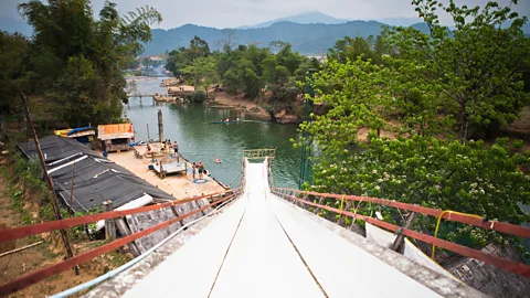 Getty Images Giant water slides into the Nam Song River were all part of the Vang Vieng party experience (Credit: Getty Images)