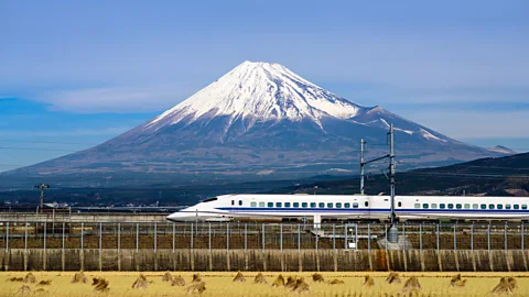 Alamy A bullet train in Japan with Mt Fuji in the background (Credit: Alamy)