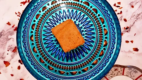 Dhayanie Williams Sri Lankan love cake on blue patterned plate (Credit: Dhayanie Williams)