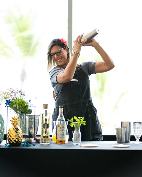 Caribe Hilton Bartender Virgie Nieves switches up her recipe by adding unique flavours or different alcohols (Credit: Caribe Hilton)