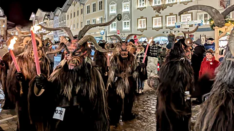 Getty Images On 5 December, townsfolk and villagers across the Alpine region don Krampus masks and costumes (Credit: Getty Images)