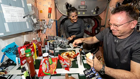 Nasa/ Esa Astronauts eating pizza on the ISS (Credit: Nasa/Esa)