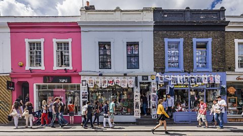 Colourful retail shops on a high street.