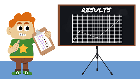 A young boy holding a clipboard stood next to a blackboard with a line graph drawn on it