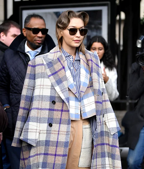 Getty Images US model Gigi Hadid attends Paris Fashion Week in a tweed ensemble (Credit: Getty Images)