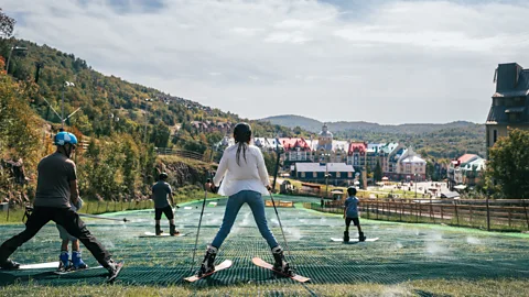 Tremblant People skiing on a dry slope (Credit: Tremblant)