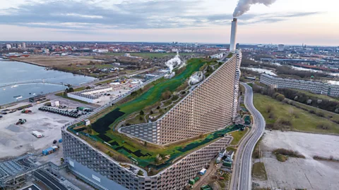 Alamy Some 10,000 skiers now "dry slope" ski on Copenhagen's incineration plant every year (Credit: Alamy)