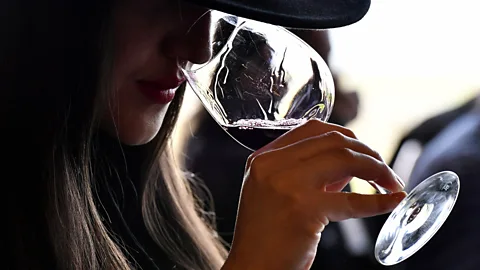 Getty Images A woman drinking a glass of red wine (Credit: Getty Images)