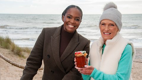 Mary Berry and Oti Mabuse stand on Rye beach with a jar of chutney