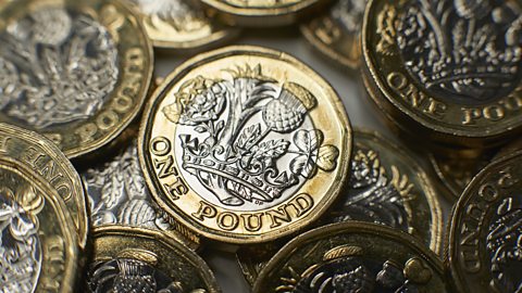 A pile of pound coins to represent the minimum wage.