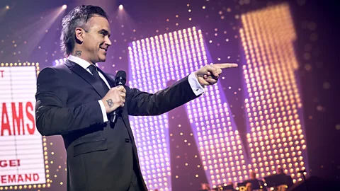 Paramount Pictures Robbie Williams is one of the UK's biggest pop stars – having started out in boy band Take That (Credit: Paramount Pictures)