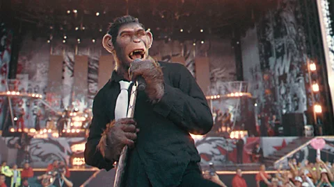 Paramount Pictures In Better Man, directed by Michael Gracey, Williams is depicted as a CGI chimpanzee (Credit: Paramount Pictures)