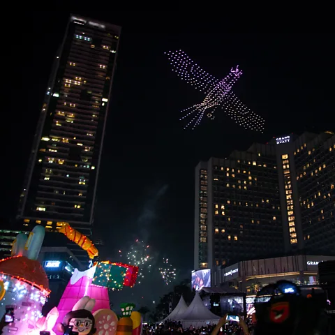 Getty Images Light shows using drones and beams of coloured light are starting to appear as alternatives to fireworks (Credit: Getty Images)