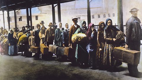 Colourised photo of European arrivals at Ellis Island, New York, 1900s.