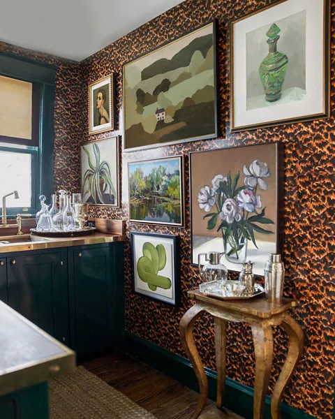 Artfully Walls Multiple paintings displayed together work well in a maximalist interior, giving a cosy feel (Credit: Artfully Walls)