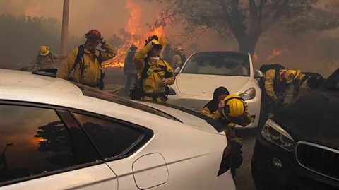 Getty Images Abandoned cars have hindered the ability of firefighters as they have battled with the flames (Credit: Getty Images)