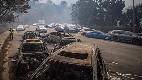 Getty Images Abandoned cars and burned debris can further hampered evacuation efforts by blocking LA's already congested roads (Credit: Getty Images)