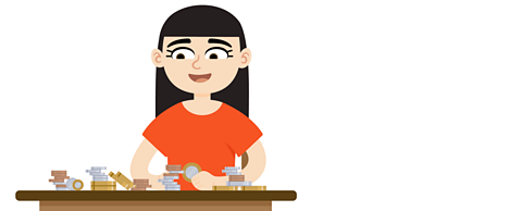 Kelly smiling, sat at a desk counting piles of money.
