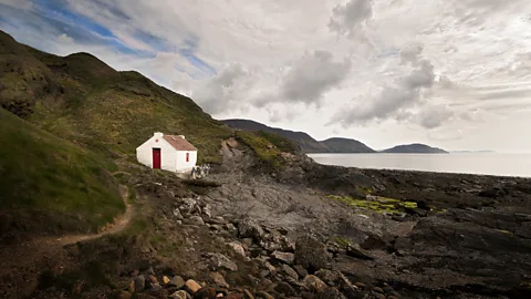 Getty Images One of the best ways to get to the heart of this cliff-fringed island is to explore it on foot (Credit: Getty Images)